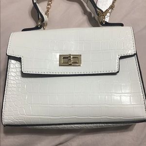 White crocodile print cross body .